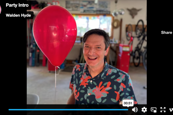 Robb in his workshop with a red balloon