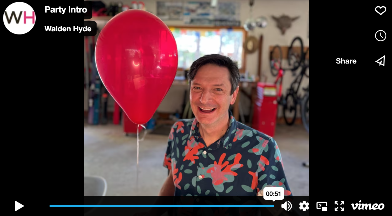 Robb in his workshop with a red balloon