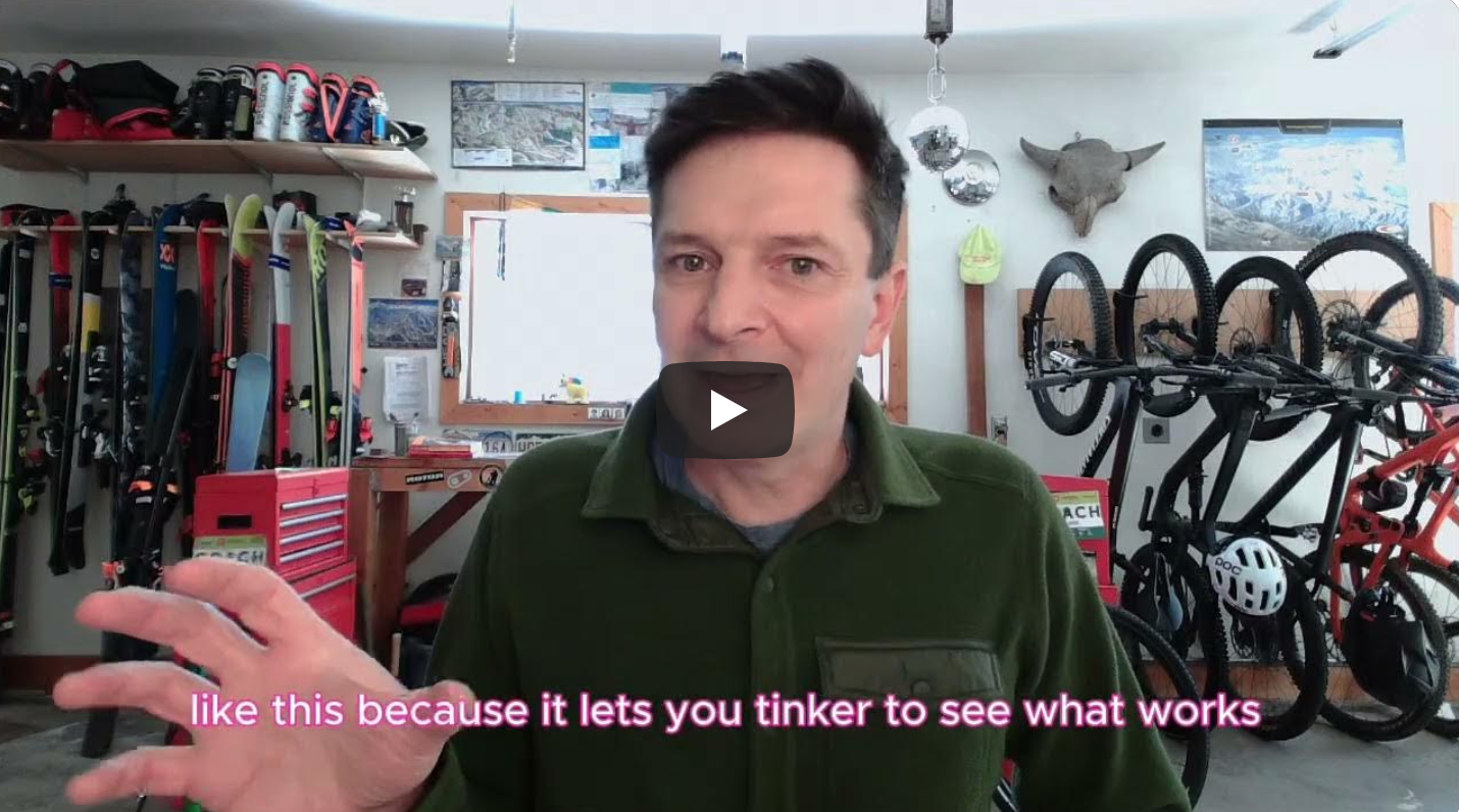 Robb in his workshop with pink words on screen about marginal gains allowing you to tinker