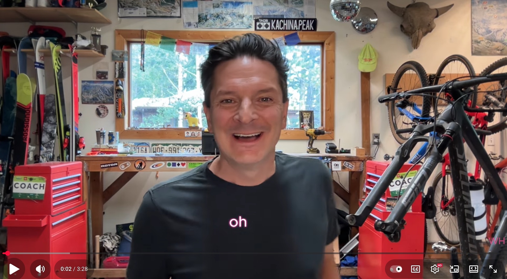 Robb in workshop with the words "oh" below in pink